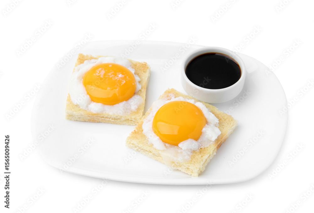 Fototapeta premium Tasty kaya toasts with half-boiled eggs and soy sauce isolated on white. Traditional asian breakfast