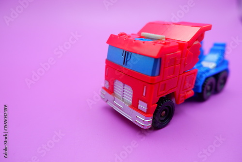 Obraz na plátně Miniature Action Truck on Vibrant Pink Surface
