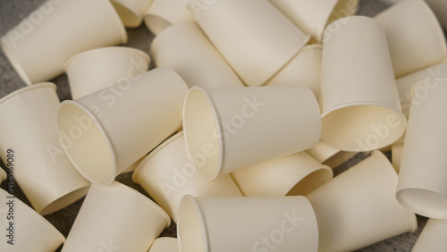Scattered Pile of Plain White Disposable Paper Cups. Eco-Friendly Drinkware for Events, Offices, or Crafts