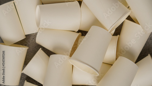 Scattered White Disposable Paper Cups Pile