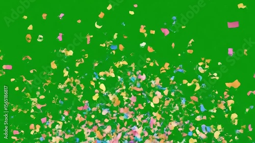 Pastel confetti falling slowly on green screen