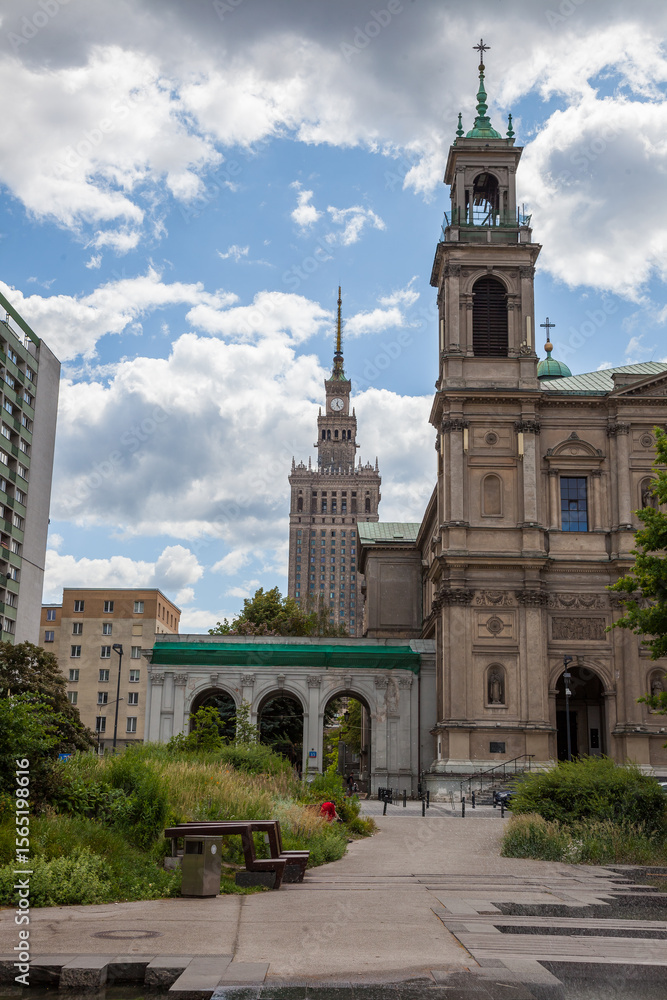 Fototapeta premium All Saints Church, Grzybowski Square Plac Grzybowski . Warsaw, Poland. houses and streets of the city center. Tourist route. Historical landmark. Old and new architecture sight