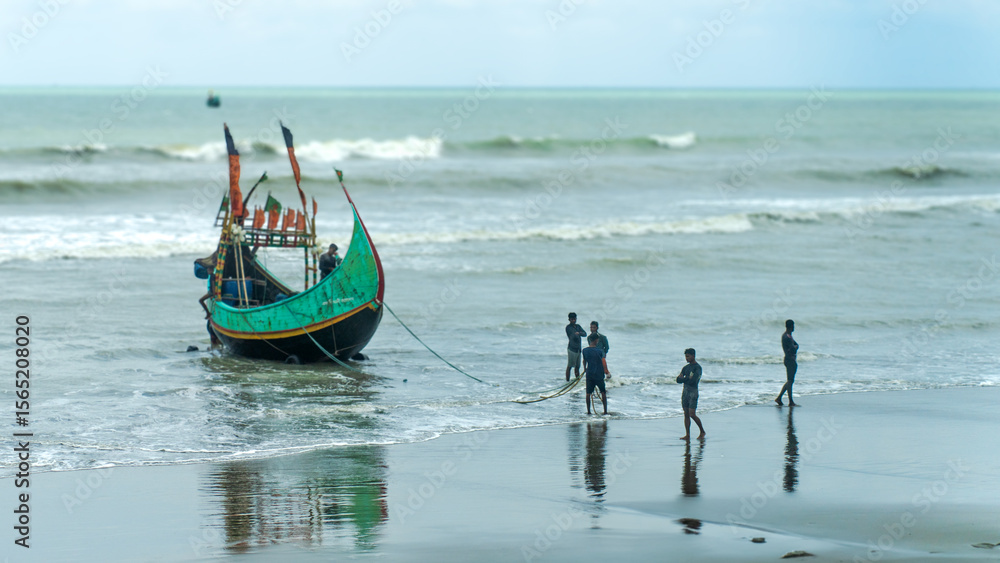Naklejka premium fishing boat on the beach
