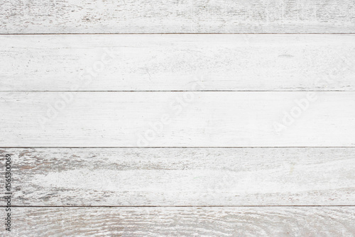 The white wooden walls have a peeling paint texture.