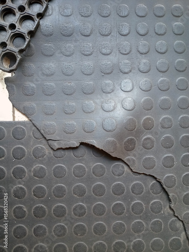 Close up of Damaged Black Rubber Flooring
