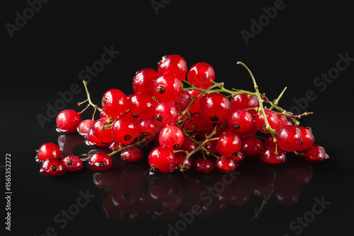 Red berries. Red currant. Heap of red berries on black background