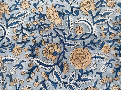 Canvastavla Intricate Mughal floral motifs in calming blue and beige tones are delicately block printed on soft cotton fabric