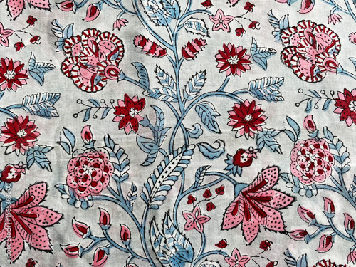 Obraz na płótnie Intricate Mughal floral block prints grace the soft cotton fabric, showcasing finely detailed motifs in graceful symmetry