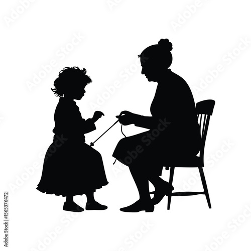 A heartwarming silhouette of a grandmother teaching her granddaughter to knit together.