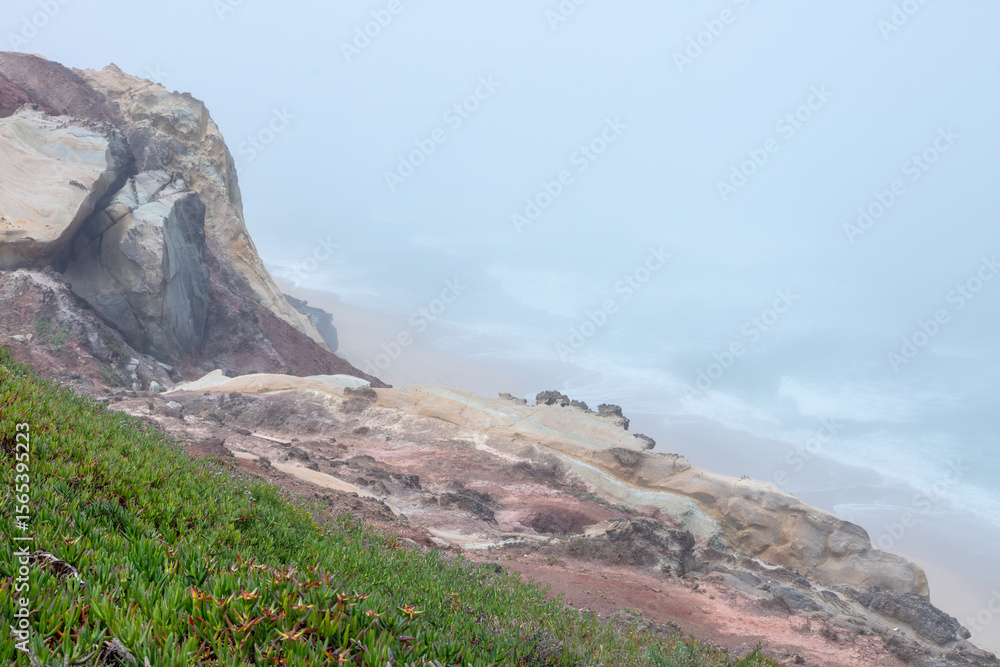 Obraz premium Foggy Summer Morning at Santa Cruz Beach, Torres Vedras, Portugal. July 4, 2025