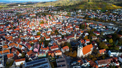 Fototapeta Naklejka Na Ścianę i Meble -  Aerial view of the old town of the city Metzingen
 in Germany on a sunny afternoon in autumn