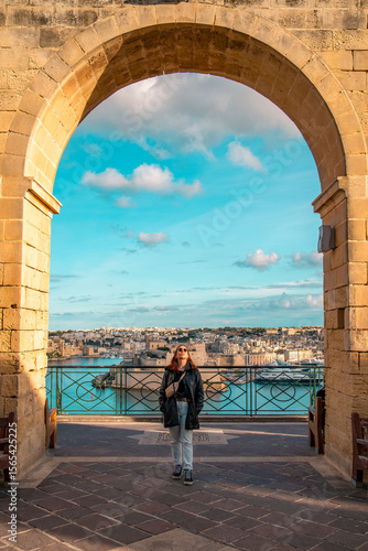 Girl exploring the historic alleyways of Valletta, Malta
