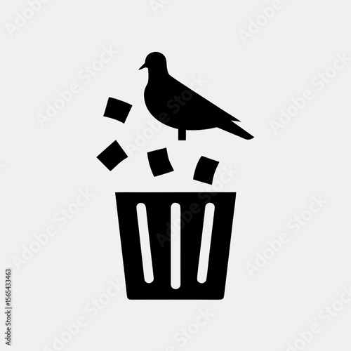 One-legged pigeon standing on overflowing trash bin_2