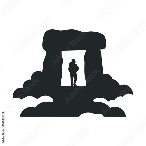 Silhouette of ancient stone structure with standing figure