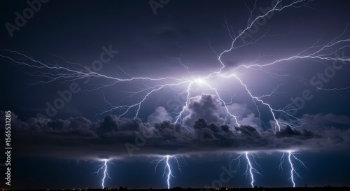 Wallpaper Mural Dramatic nighttime scene showcasing a powerful lightning storm with multiple forks of lightning illuminating dark clouds and a distant horizon Torontodigital.ca