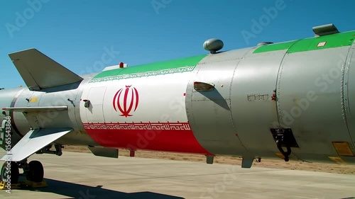 Close up of a missile with the iranian flag painted on the side outdoors view