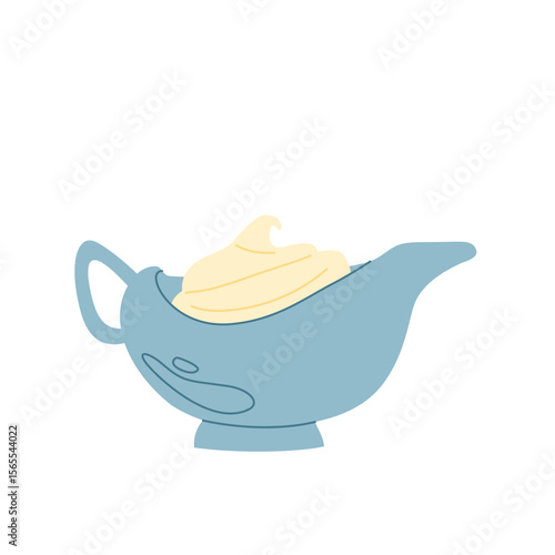 Elegant gravy boat with sauce in soft pastel blue.