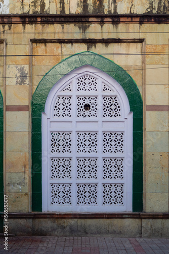 Decorative stone carved Windows & Arches of Imam Bada, Indore, (M.P.). Old sacred place of Shia Muslims build in 1908. Indian Architecture. Selective Focus.
