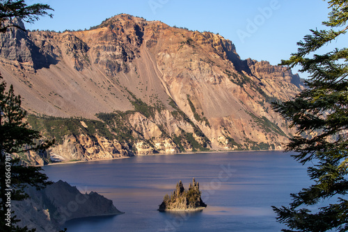 Phantom Ship is a distinctive rock formation island in Crater Lake, Oregon, resembling a ship, particularly in foggy or low-light conditions. It's a natural andesite rock pillar, one of two islands.