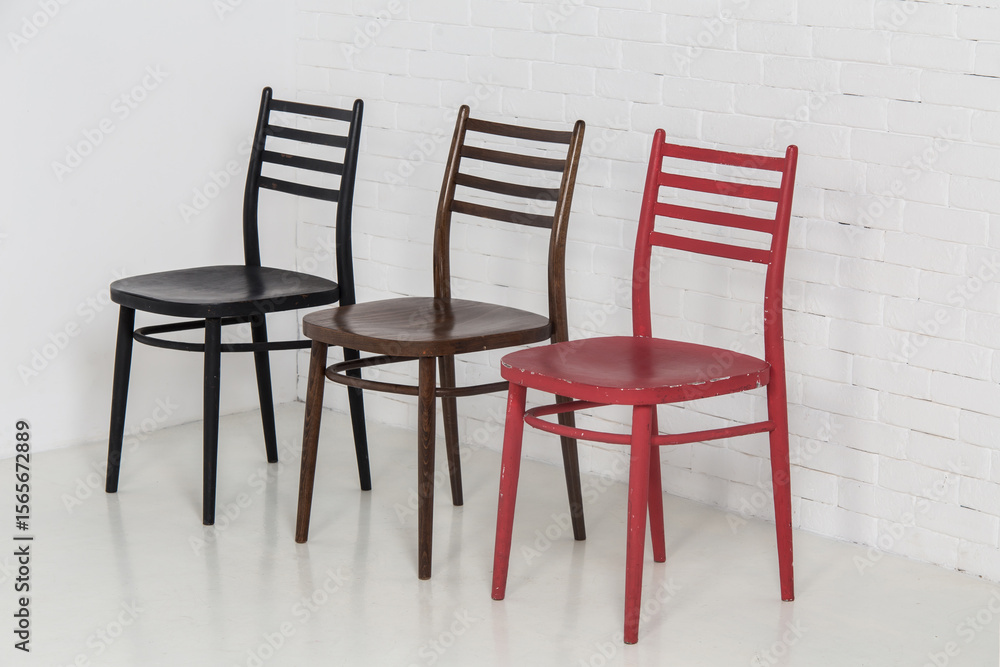 Fototapeta premium Three chairs in the room