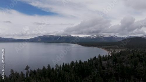 Snow storm arriving over South Lake Tahoe looking toward Heavenly Valley on a cold May day with snow and freezing rain Drone footage