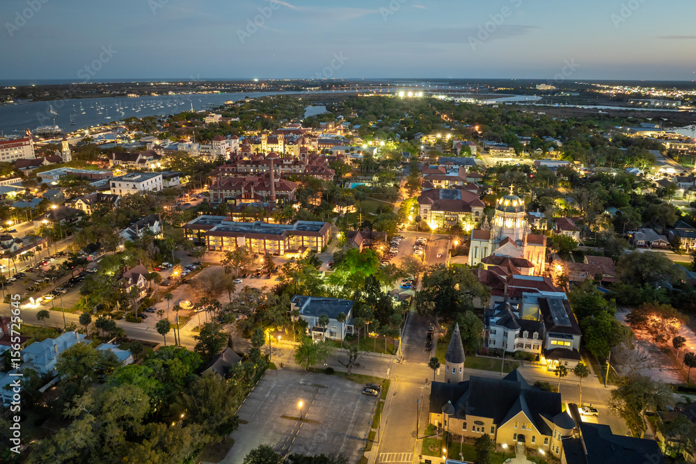 Fototapeta premium St. Augustine, Florida. American architecture with illuminated city streets and historical buildings at night. USA travel destination