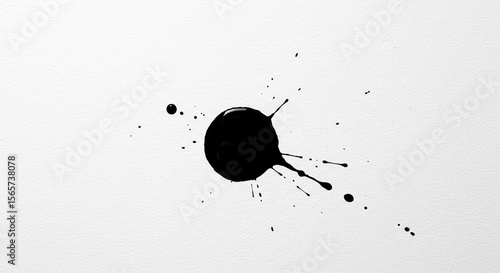 Abstract black ink blot on white paper background for artistic design, paint splatter art