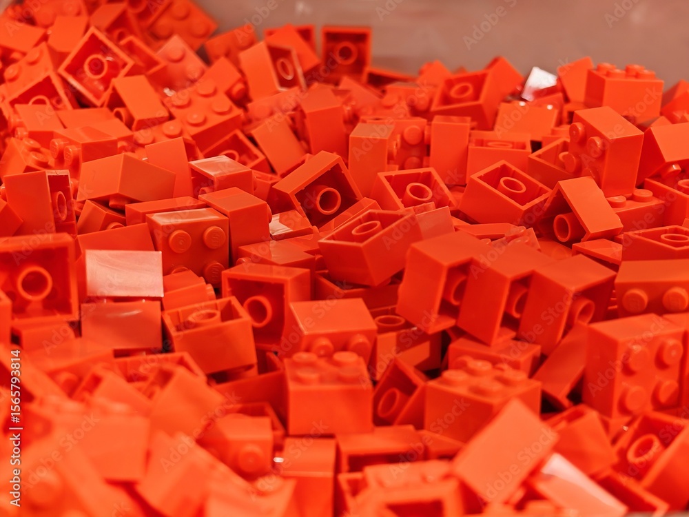 Obraz premium Apr 10, 2025 - Hong Kong: Pile of bright orange LEGO bricks scattered in a vibrant, uniform color.