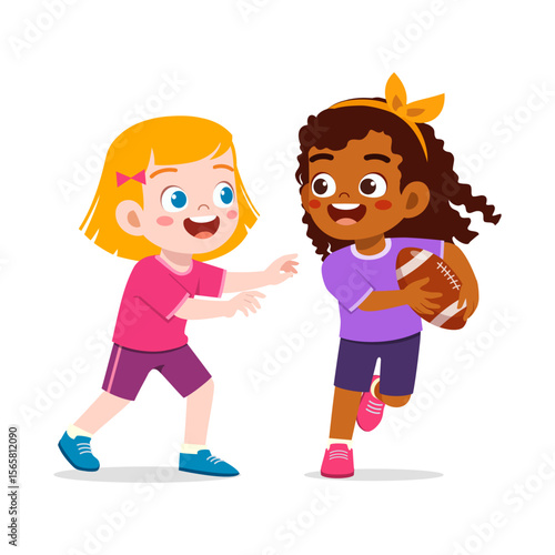Two young girls are playing football, one is blonde and other is african american.