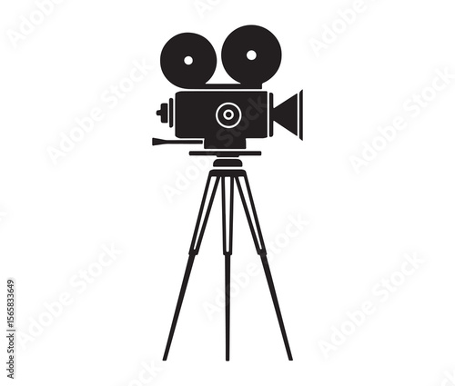 Silhouette of an old movie camera on a tripod. Vintage movie camera on tripod silhouette.