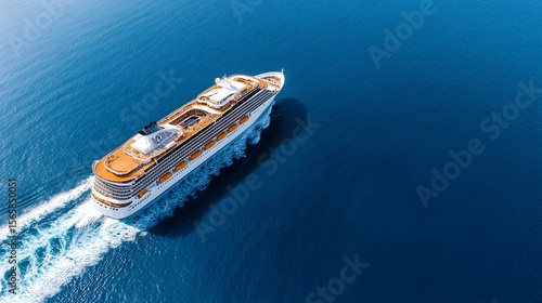Cruise ship sailing on blue ocean water aerial view.