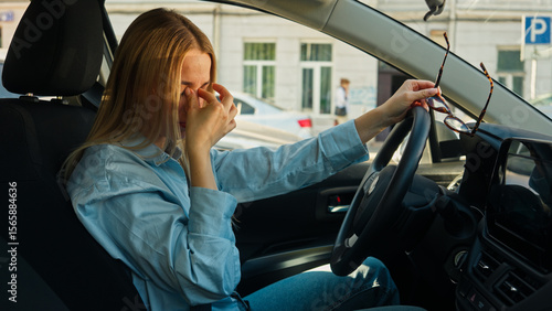 Tired woman driving take off eyeglasses vision rubbing eyes car girl female traffic jam auto exhaustion overworked eyesight burnout businesswoman fatigue transportation rent service test drive vehicle