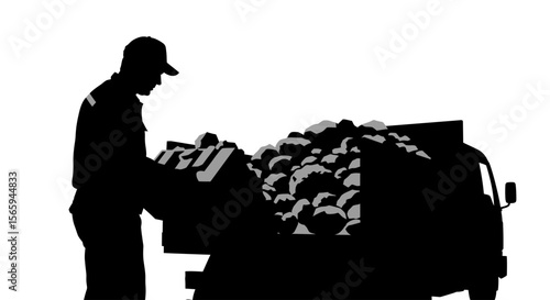 A worker unloads a truck filled with produce, carefully examining the crates.