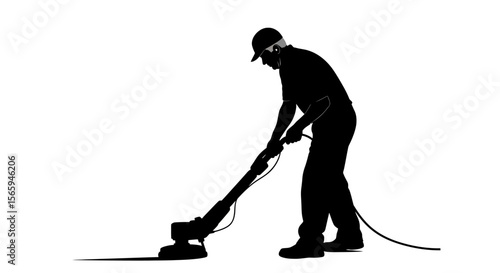 A silhouetted worker diligently operates a floor-cleaning machine, showcasing hard work and maintenance.