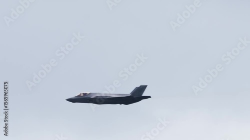 F-35 Lightning Stealth Fighter Closeup Tracking Shot with Vapor Trails. 