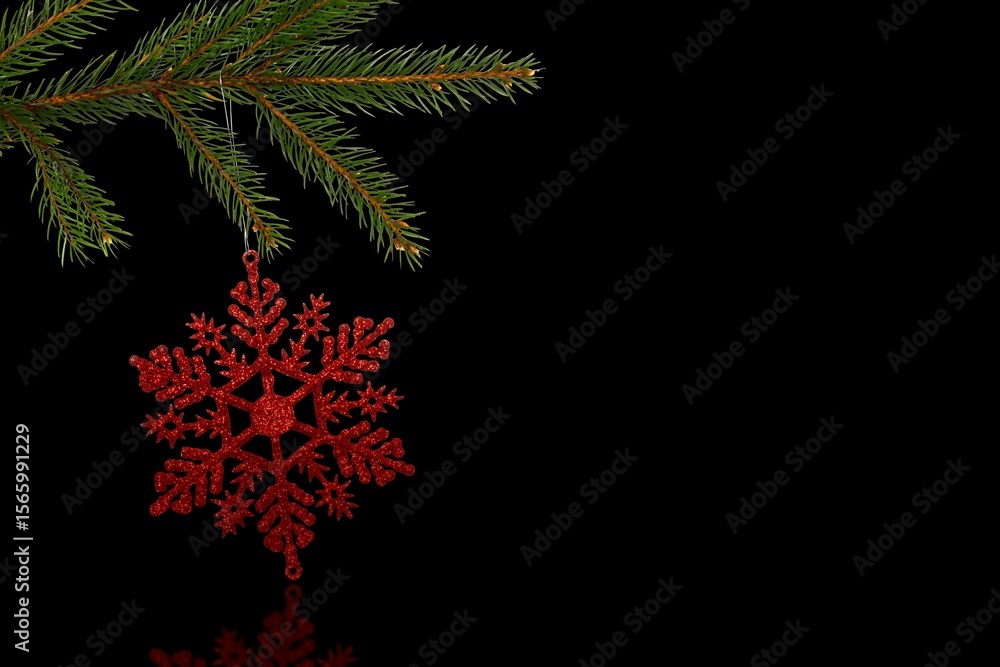 Obraz premium 3D art showing red glittery snowflake ornament hanging on pine branch over black surface copy space