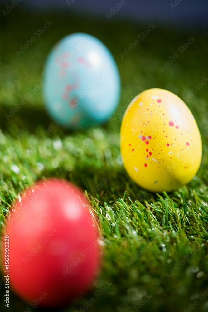 Obraz premium Colorful Easter eggs with focus on yellow