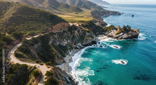 Aerial view of big sur coastline with winding road and turquoise ocean water on a sunny day