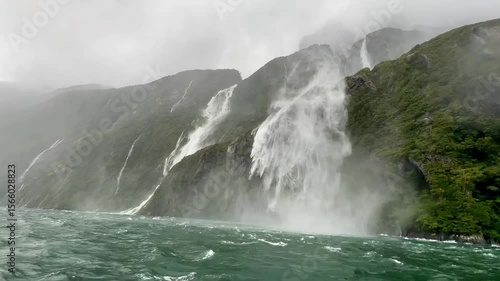 Milford Sound: Majestic Waterfalls in Misty Splendor
