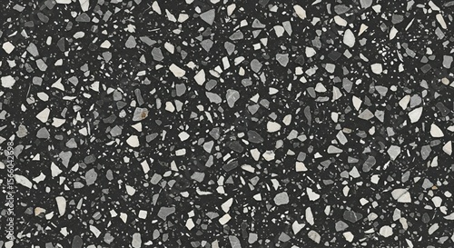 Dark terrazzo texture showcases a speckled design with black, gray, and white stone fragments creating a modern surface