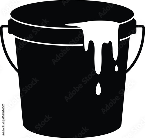 A black paint bucket with white paint spilling over is isolated on white background
