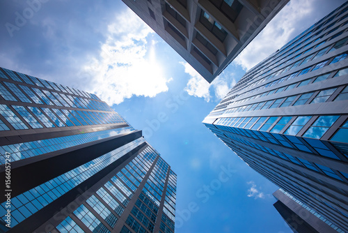 A cityscape of moving cloud reflecting the office building at the business town