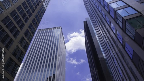 Wallpaper Mural A timelapse of moving cloud reflecting the building at the city low angle view Torontodigital.ca