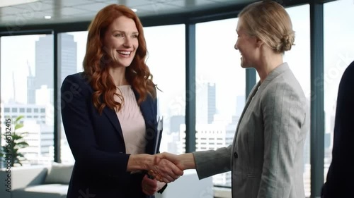 Wallpaper Mural Business women shaking hands in modern office Torontodigital.ca