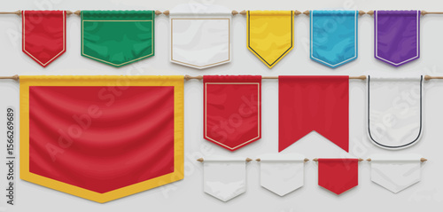 Collection of colorful blank pennant banners hanging on wooden poles