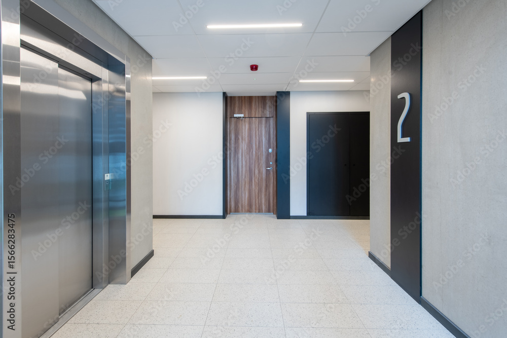 Fototapeta premium Modern Building Interior with Staircase and Elevator on the Second Floor