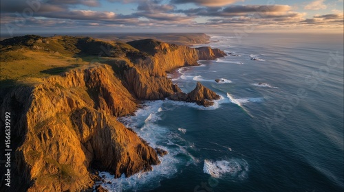 Dramatic Coastal Cliffs at Sunset with Ocean Waves and Rugged Landscape
