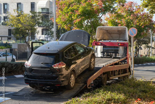 A Car Loaded on a Tow Truck