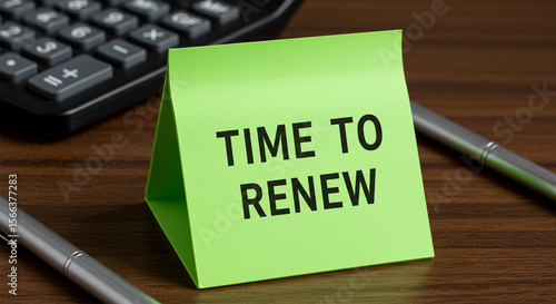 Time to Renew: A close-up shot showcasing a lime green sticky note with the message 