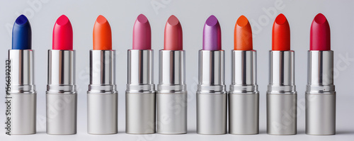 Colorful row lipstick shades silver tubes vibrant beauty product makeup concept horizontal cosmetic branding clean design retail banner skincare fashion editorial ecommerce ad variety gradient mockup